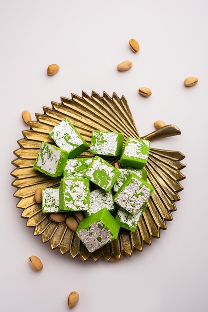Pistachio mavaãâ or khoa sweet otherwise called as pista barfi, burfi, barfeeãâ or peda, an indian sweet green in color