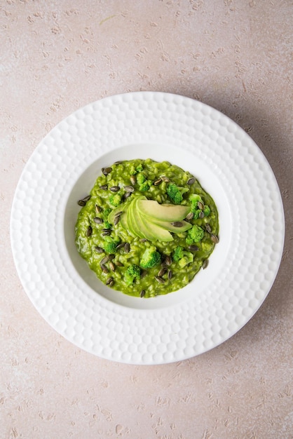 Pistachio Nut and white plate Sliced green pistachios on a white background