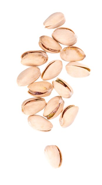 Pistachio nuts, isolated on white background. Salted roasted pistachios. Top view.
