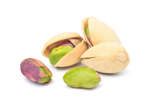 Photo pistachio nuts  isolated on white background.