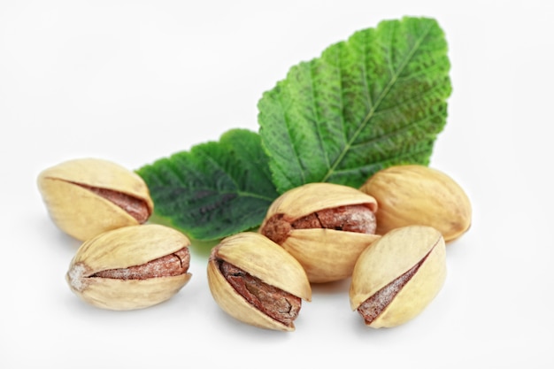 Pistachio nuts on a white background