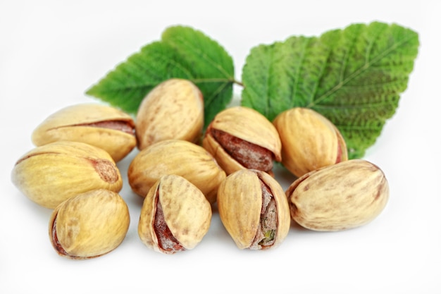 Pistachio nuts on a white background