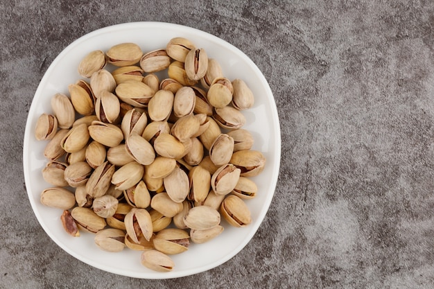 Pistachios are delicious nuts on a plate