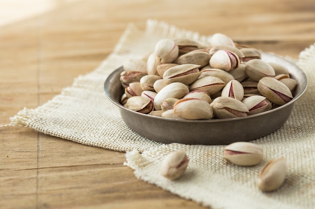 Pistachios in bowl. Salted pistachios. Pistachios in shell.