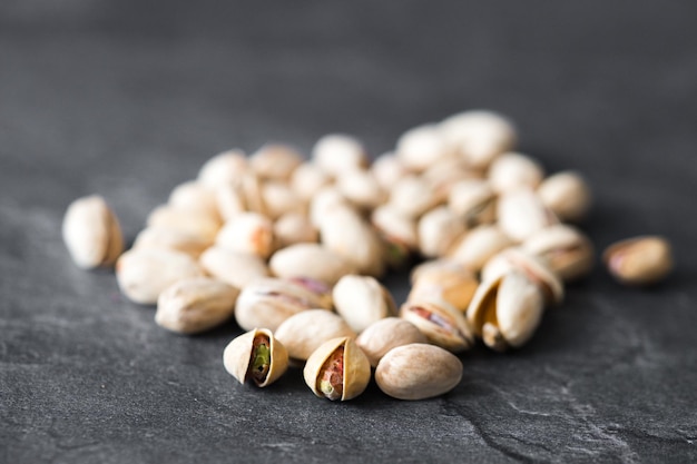 Pistachios isolated on a grey background