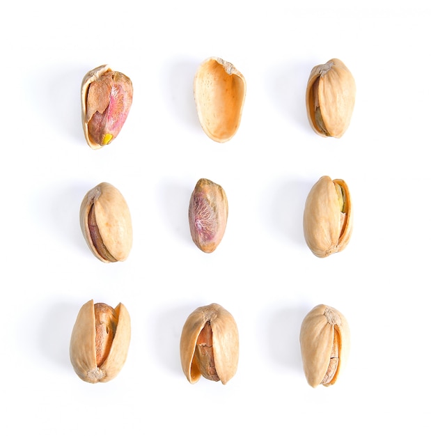 Pistachios isolated on white surface, top view.