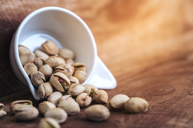 Pistachios in a white cup