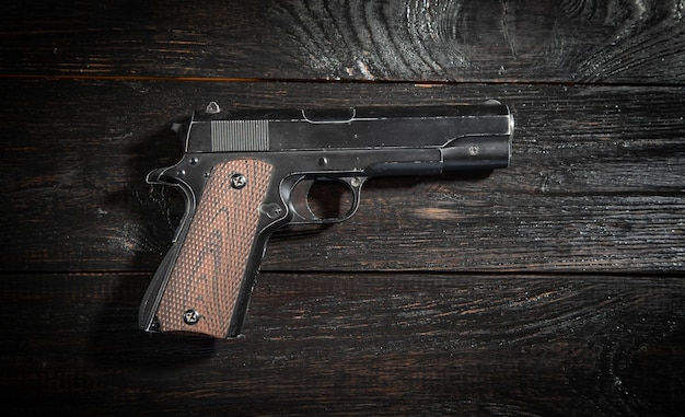 Photo pistol on the dark background