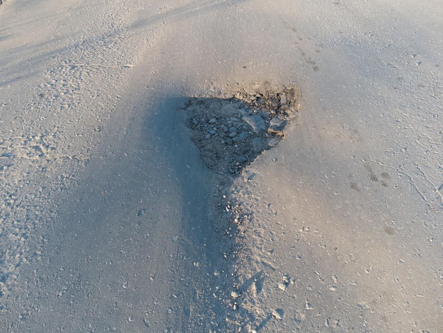 Pit on the asphalt Pothole on the road surface