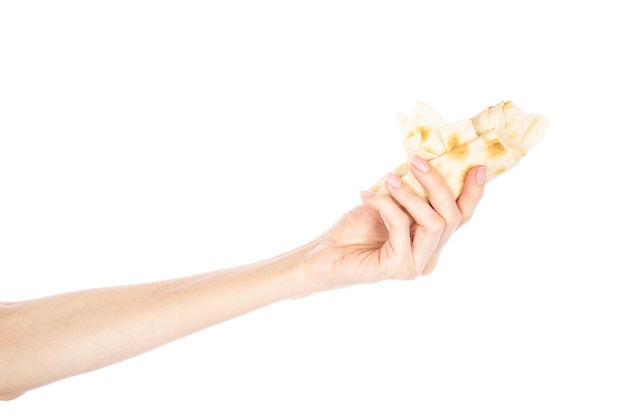 Pita bread in female hand isolated on white background Woman holding pita in her hand