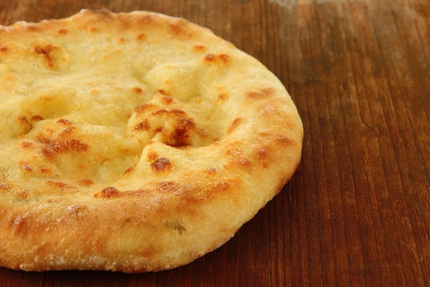 Pita bread on wooden background