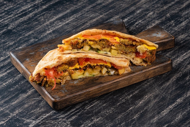 Photo pita with falafel and fresh vegetables