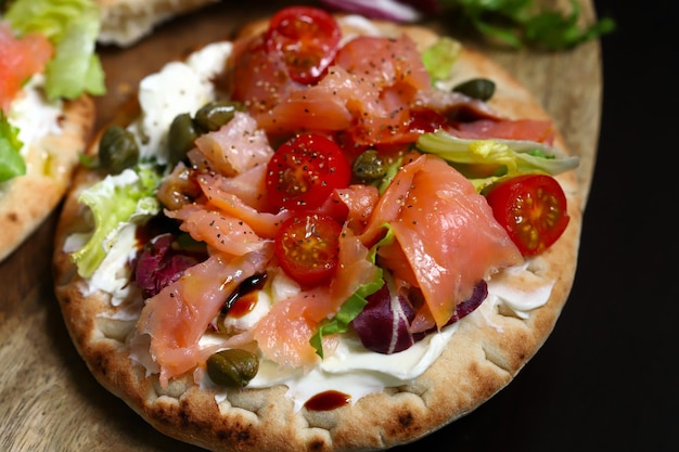 Pita with salmon capers and vegetables