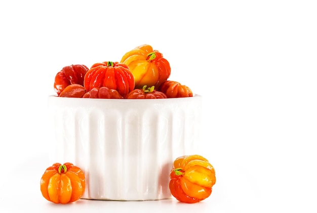 Pitangas bowl isolated on white background typical south american fruit brazil cherry white background and copyspace