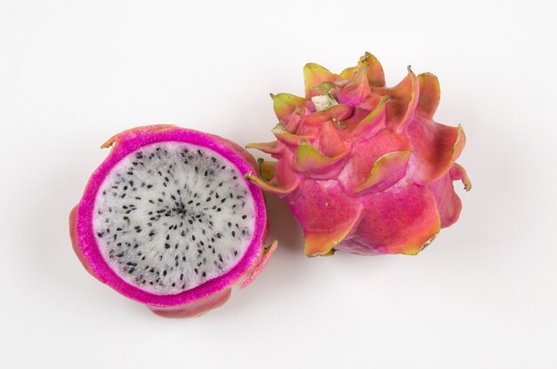 Pitayas/Dragonfruits halves over white background