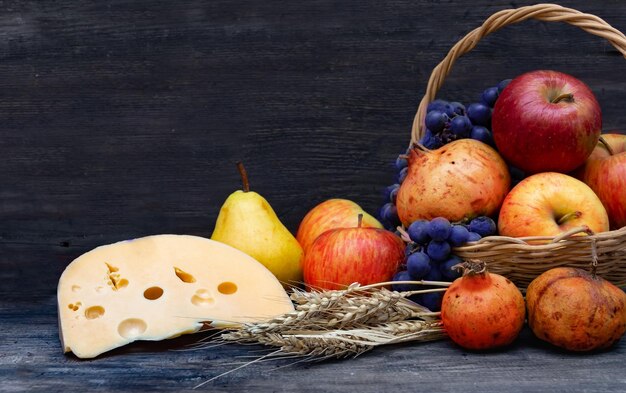 pitcher with milk, cheese wheat and fruits Shavuot concept