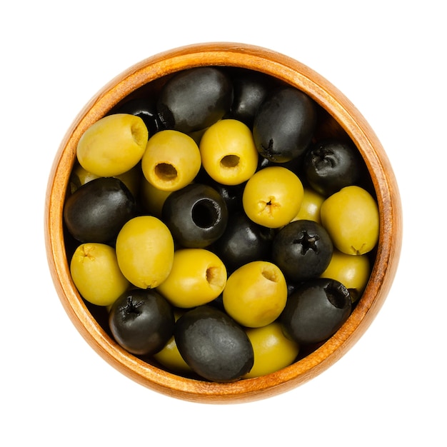 Pitted green and black Hojiblanca olives in a wooden bowl