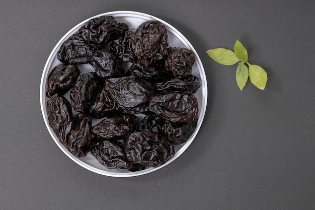 Pitted prunes served on gray 