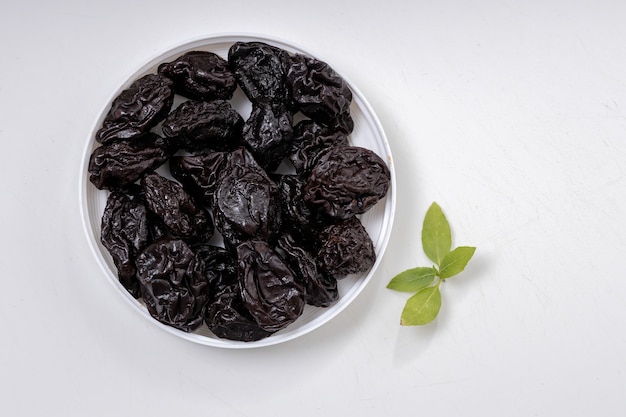 Pitted prunes served on plain white 