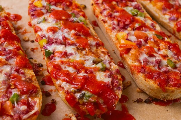 Pizza on a baguette top view closeup no people fast food street food