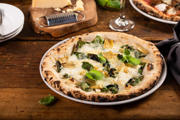 Pizza bianca or white pizza with artichokes and basil