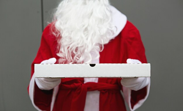 pizza box in the hands of Santa Claus