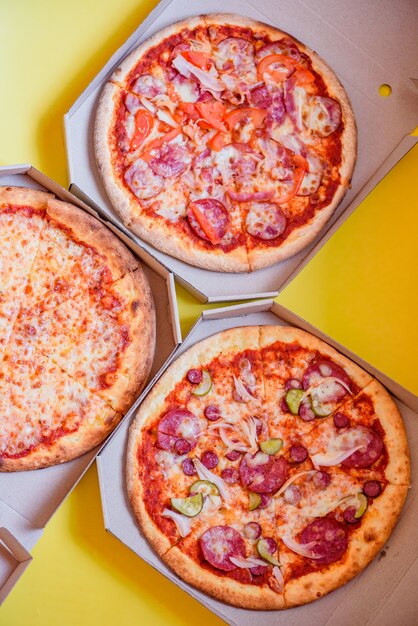 Pizza in brown corrugated cardboard box, take-out box, top view