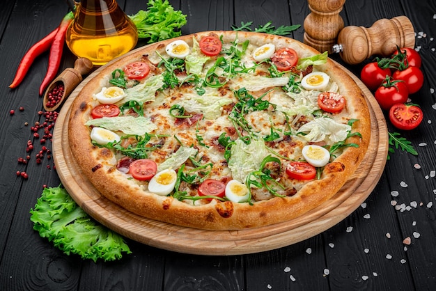 Pizza Caesar on board on wooden table