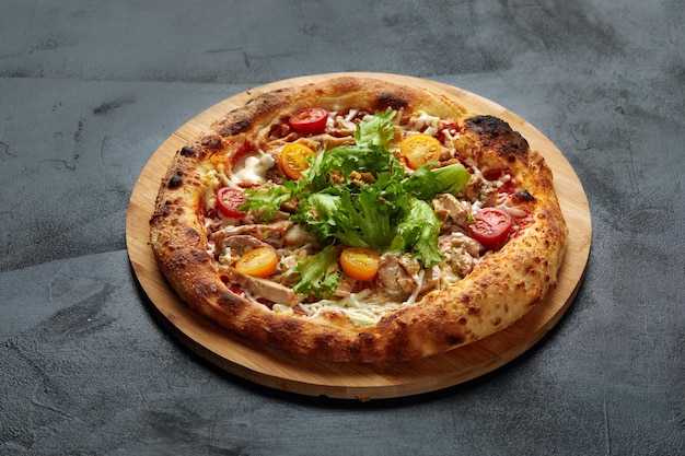 Pizza Caesar Pizza with chicken tomato cheese and lettuce on stone background Top view Free space for your text Delivery food