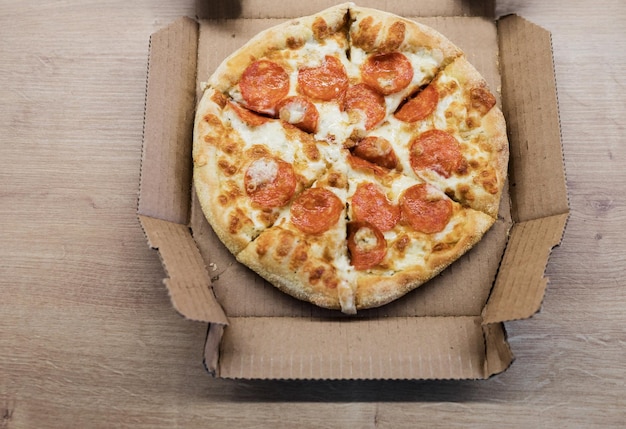 Photo pizza in a cardboard box