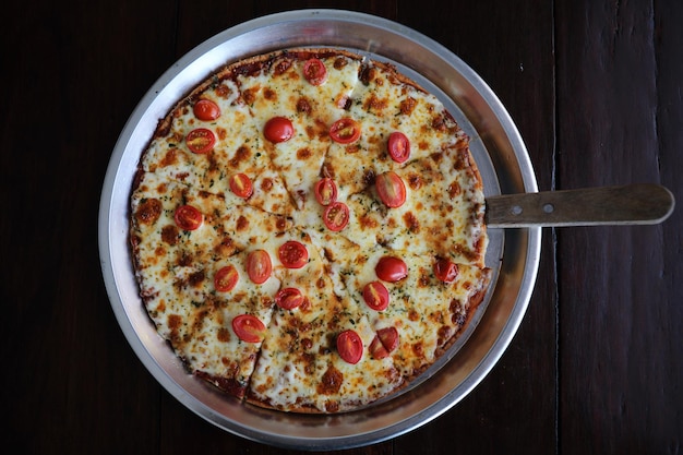 Pizza cherry tomato on wood background