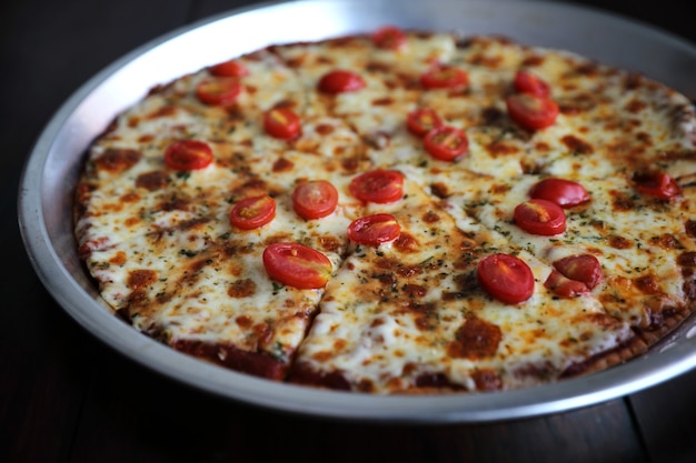 Pizza cherry tomato on wood table