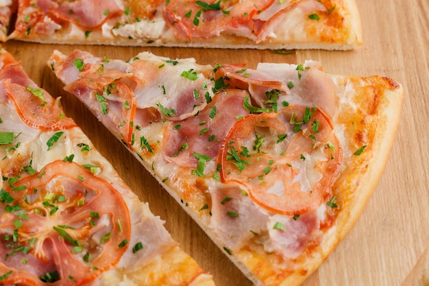 Pizza close-up on white wooden surface