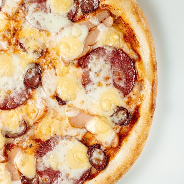 Pizza Close Up with salami sausage and cheese isolated on white background Copyspace Top view