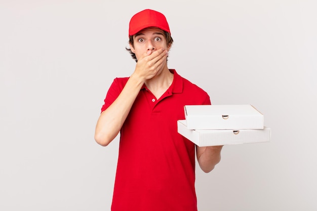 Pizza deliver man covering mouth with hands with a shocked