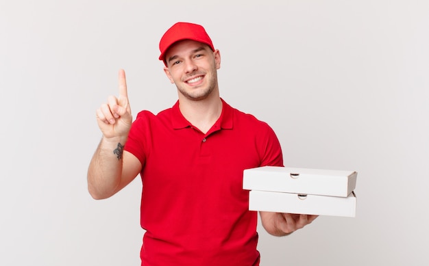 pizza deliver man smiling and looking friendly, showing number one or first with hand forward, counting down