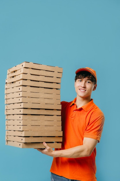 Pizza delivery concept Pizza delivery man with lots of pizza boxes Photo mockup