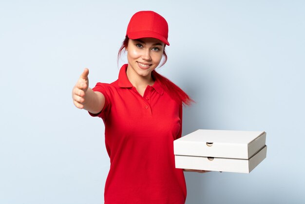 Pizza delivery girl holding a pizza