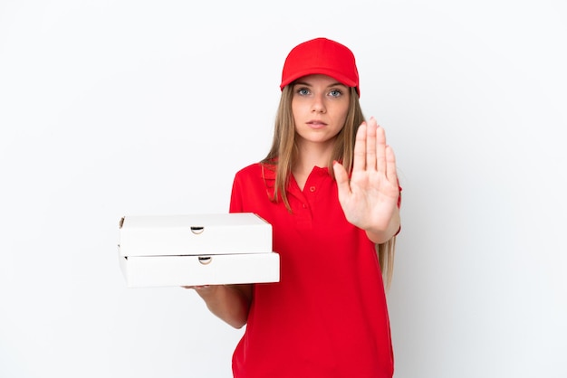 Pizza delivery Lithuanian woman isolated on white background making stop gesture