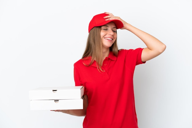 Pizza delivery Lithuanian woman isolated on white background smiling a lot