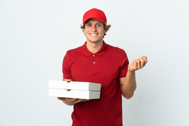 Pizza delivery man over isolated white wall making money gesture