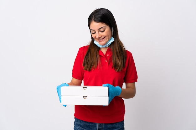 Pizza delivery woman holding pizzas