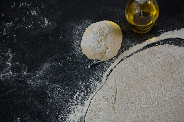 Pizza dough ball and flour