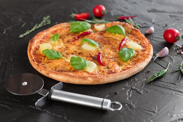 Pizza, food, vegetable.  Vegetables, mushrooms and tomatoes pizza on a dark background. It can be used as a background