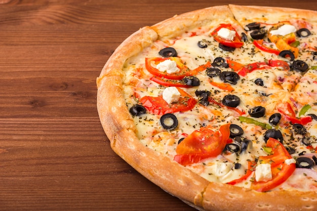 Pizza ham with cheese, tomatoes and pepper.