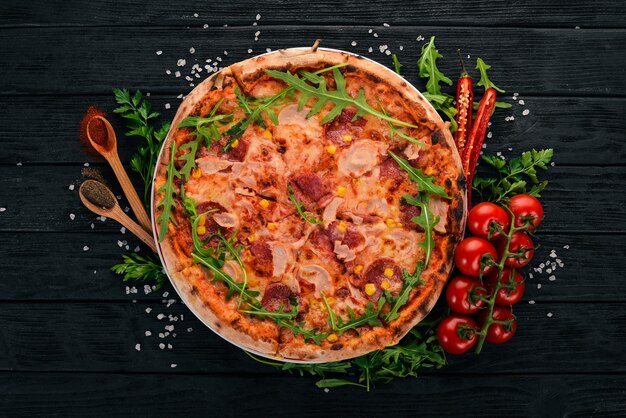 Pizza Italian cuisine On a wooden background Copy space