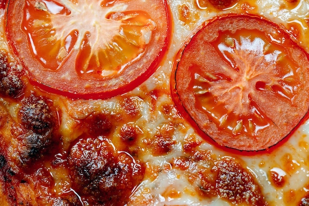 Pizza Margarita close up with cheese and tomatoes.