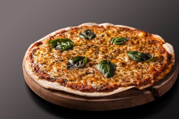 Pizza Margherita on Dark Table