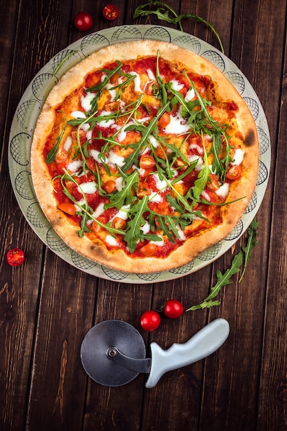 Pizza Margherita with Buffalo mozzarella, tomatoes and fresh basil