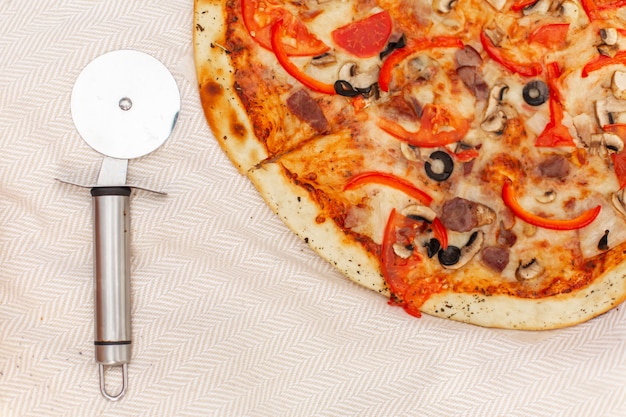 Pizza and pizza cutter